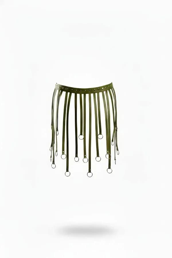 Olive green vegan leather harness skirt overlay with staggered vertical straps tipped with silver O-rings on flat lay view.