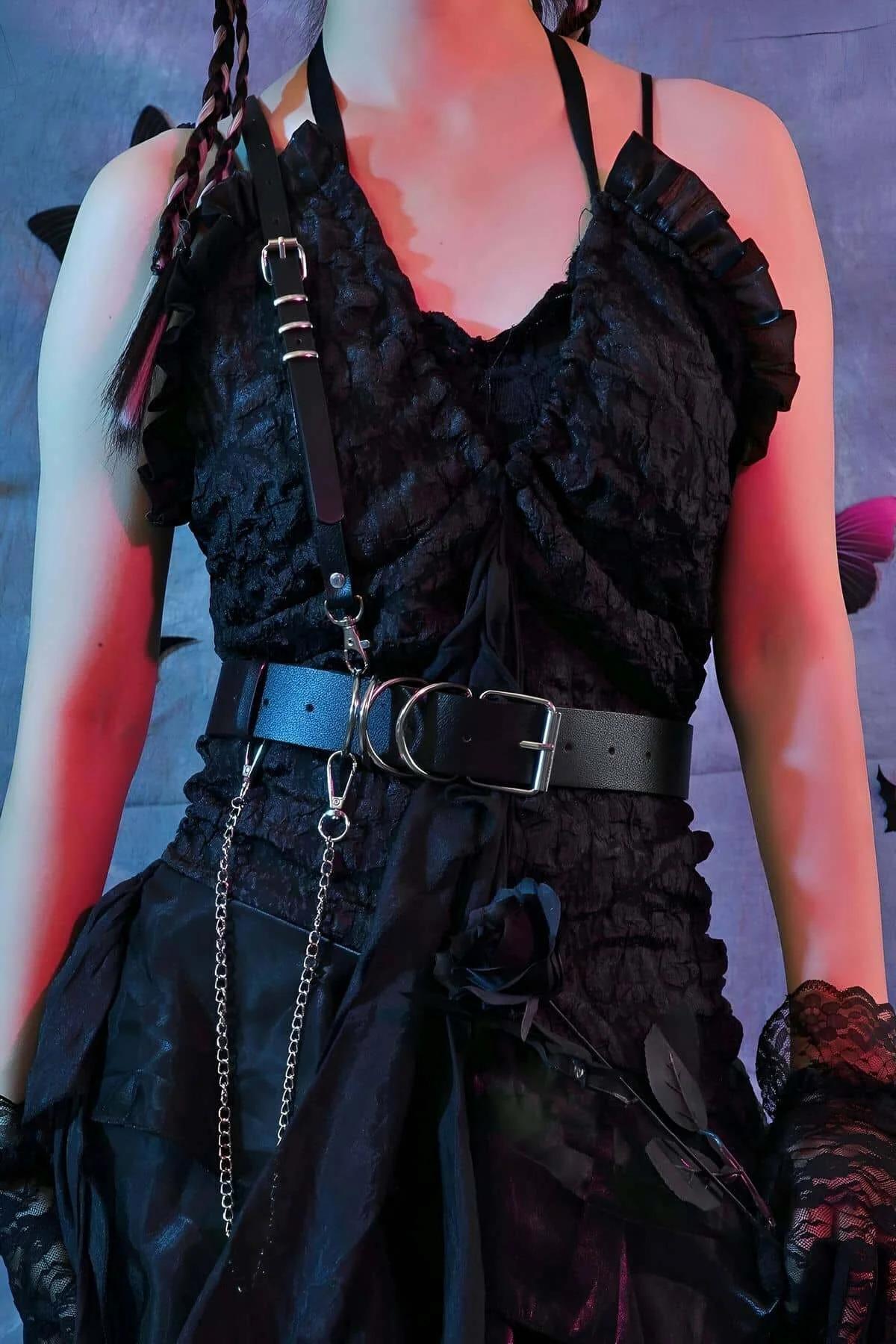 Close-Up of Silver Chain Link and D-Ring Hardware on Black Harness with Detachable Belt for Festival Outfit