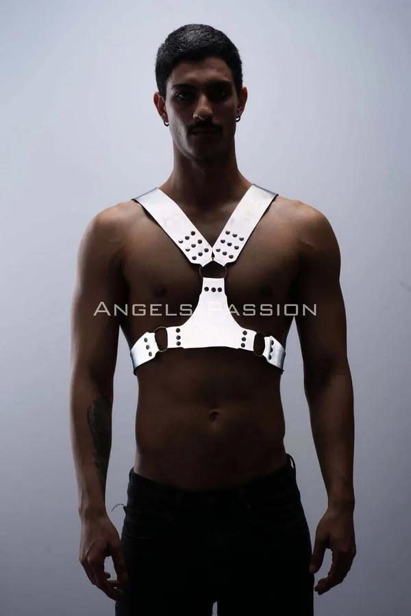 White reflective chest harness with dark O-ring accents and rivet studs worn by male model — Y-strap silhouette