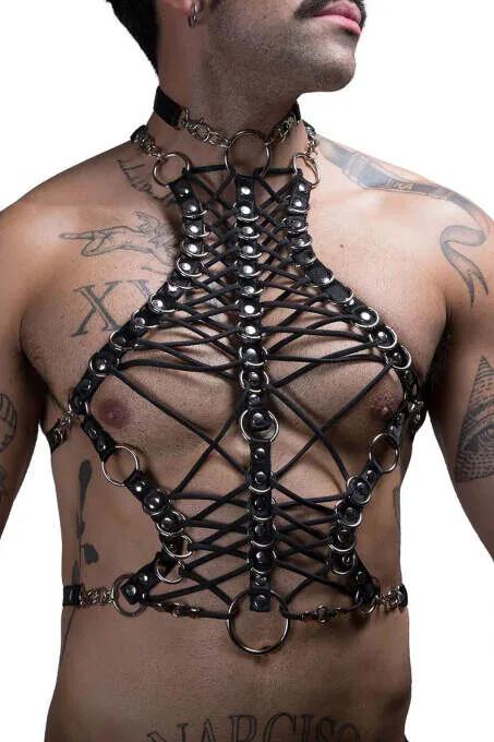 Black faux leather strappy body harness with criss-cross lacing, silver O-rings, and gold chain choker on male model